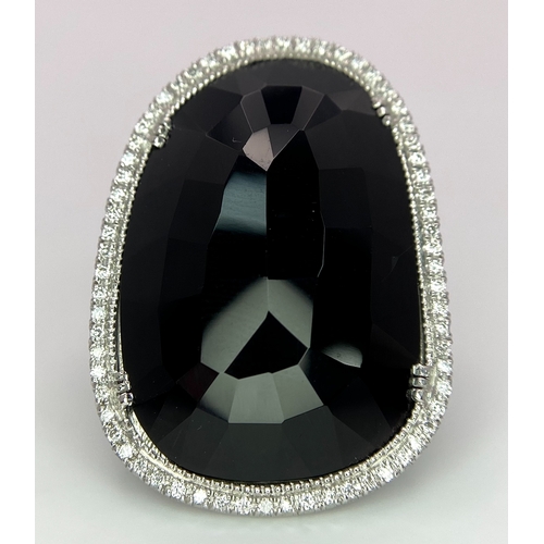 11 - A Beautiful 18k White Gold Black Onyx and Diamond Ladies Dress Ring. Faceted black onyx with a diamo... 