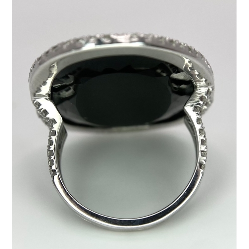 11 - A Beautiful 18k White Gold Black Onyx and Diamond Ladies Dress Ring. Faceted black onyx with a diamo... 