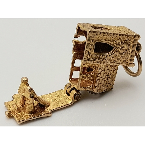 717 - A 9 K yellow gold charm in the shape of a chapel, which opens to reveal a wedding ceremony, dimensio... 