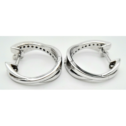 96 - A PAIR OF 14K WHITE GOLD DIAMOND EARRINGS. 0.35ctw, 1.6cm diameter, 4.8g total weight. Ref: SC 8052