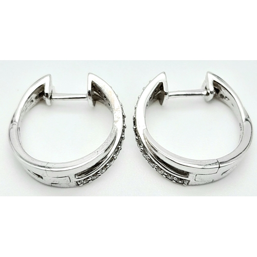 96 - A PAIR OF 14K WHITE GOLD DIAMOND EARRINGS. 0.35ctw, 1.6cm diameter, 4.8g total weight. Ref: SC 8052