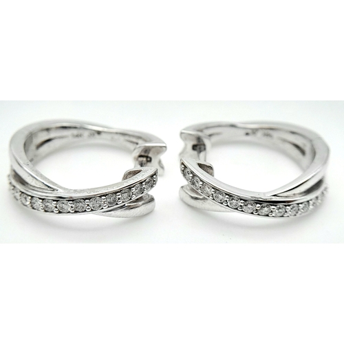 96 - A PAIR OF 14K WHITE GOLD DIAMOND EARRINGS. 0.35ctw, 1.6cm diameter, 4.8g total weight. Ref: SC 8052