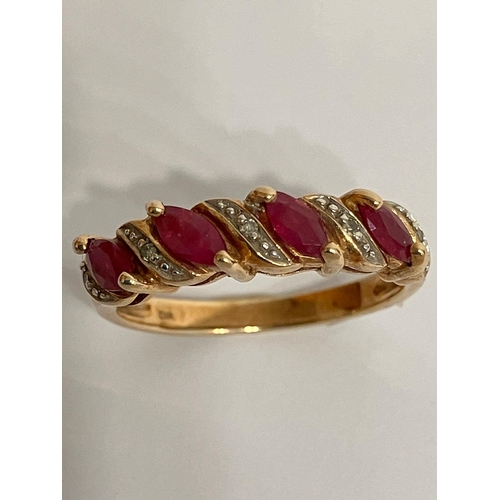 112 - Classic 9 carat GOLD RUBY and DIAMOND RING. having Rubies and Diamonds sweep mounted.   Full UK hall... 