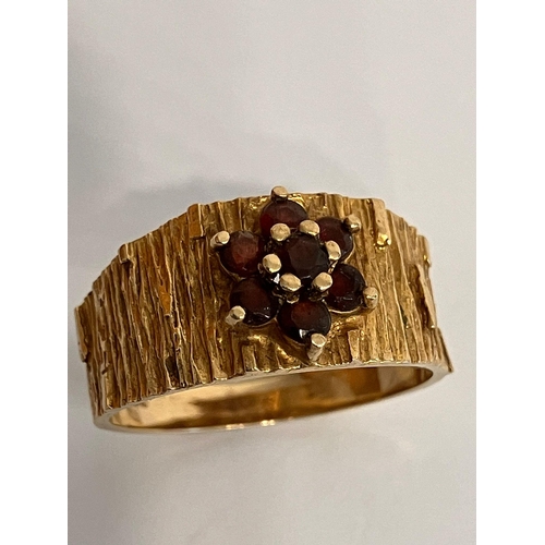 14 - Vintage 9 carat yellow GOLD and GARNET RING, having wide textured band with attractive barked detail... 