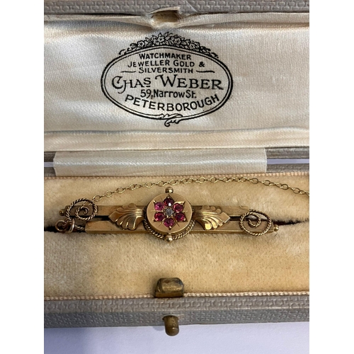 224 - Vintage 9 carat GOLD RUBY and DIAMOND BAR BROOCH. Complete with Gold safety chain. Presented in the ... 