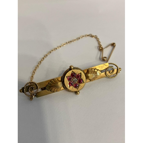 224 - Vintage 9 carat GOLD RUBY and DIAMOND BAR BROOCH. Complete with Gold safety chain. Presented in the ... 