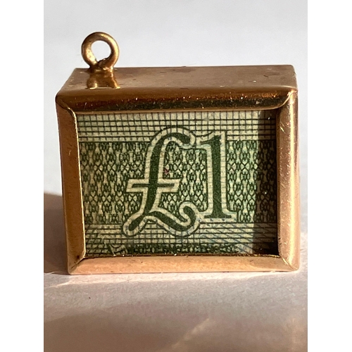 266 - Vintage 9 carat GOLD CHARM, consisting a £1 note inside a GOLD CASE. Full UK hallmark.2.85 grams.