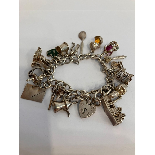 329 - Vintage SILVER CHARM BRACELET complete with safety chain , to include 18 x interesting and unusual c... 