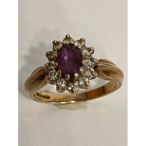 35 - Vintage 9 carat GOLD and AMETHYST RING.Having Oval Cut AMETHYST mounted to centre with clear gemston... 