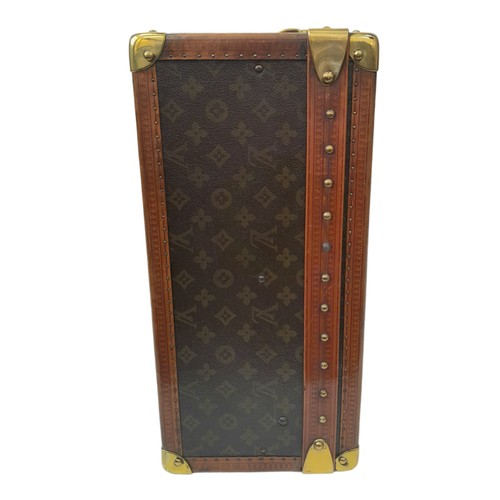 38 - A Vintage Possibly Antique Louis Vuitton Trunk/Hard Suitcase. Canvas monogram LV exterior with quatr... 