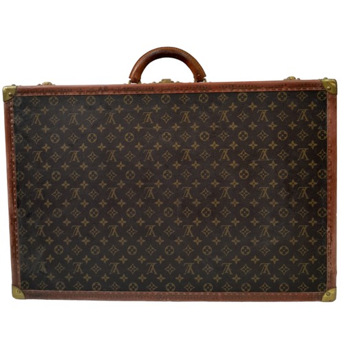 39 - A Vintage Possibly Antique Louis Vuitton Suitcase. The last lot of our LV trilogy. Canvas monogram L... 