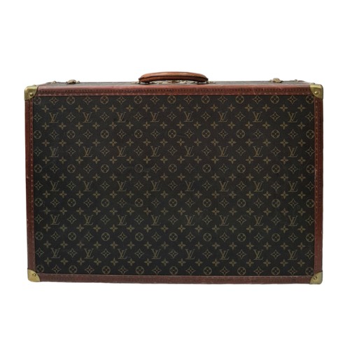 39 - A Vintage Possibly Antique Louis Vuitton Suitcase. The last lot of our LV trilogy. Canvas monogram L... 