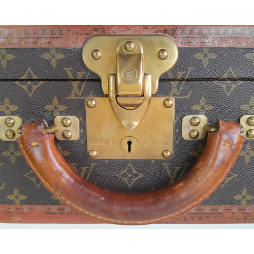 39 - A Vintage Possibly Antique Louis Vuitton Suitcase. The last lot of our LV trilogy. Canvas monogram L... 