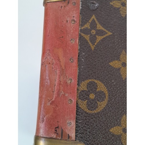 39 - A Vintage Possibly Antique Louis Vuitton Suitcase. The last lot of our LV trilogy. Canvas monogram L... 