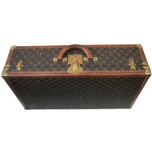 39 - A Vintage Possibly Antique Louis Vuitton Suitcase. The last lot of our LV trilogy. Canvas monogram L... 