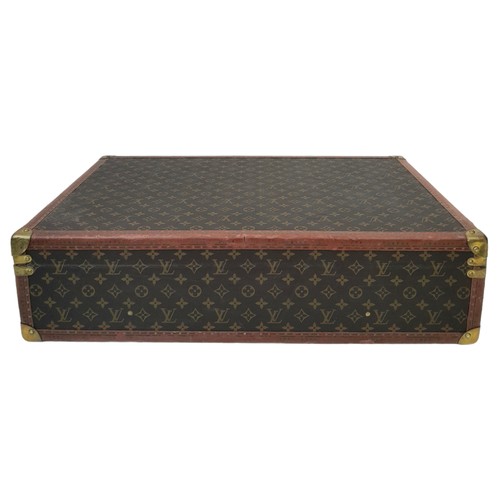 39 - A Vintage Possibly Antique Louis Vuitton Suitcase. The last lot of our LV trilogy. Canvas monogram L... 