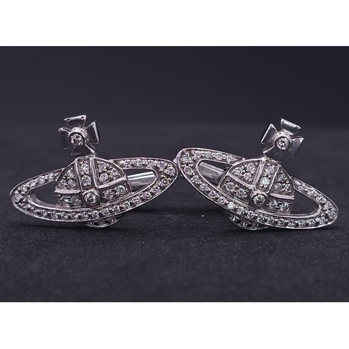 17 - A PAIR OF 18K WHITE GOLD (STAMPED & TESTED) DIAMOND SET VIVIENNE WESTWOOD CUFFLINKS. 2.5cm length, 1... 