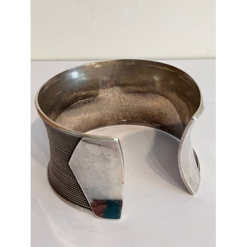 420 - SILVER CUFF BANGLE. Wide and chunky with herringbone inlaid design. Marking for 925 Silver BA. Appro... 