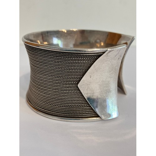 420 - SILVER CUFF BANGLE. Wide and chunky with herringbone inlaid design. Marking for 925 Silver BA. Appro... 