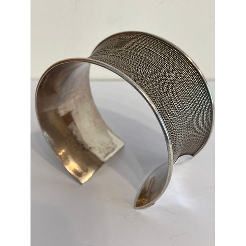 420 - SILVER CUFF BANGLE. Wide and chunky with herringbone inlaid design. Marking for 925 Silver BA. Appro... 