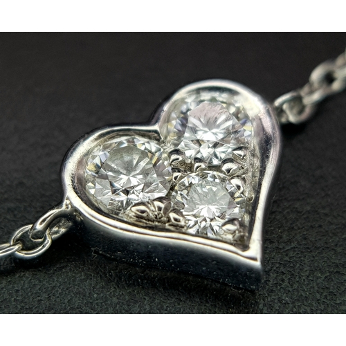 18 - A 950 Platinum Delicate Tiffany and Co. Diamond Heart Bracelet. 16cm. 2.35g total weight. Ref: 01543... 