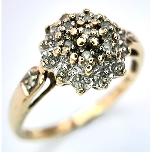 603 - A 9K YELLOW GOLD DIAMOND CLUSTER RING. Size N, 2.1g total weight. Ref: SC 8012