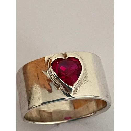 175 - Vintage SILVER and RUBY SOLITAIRE RING.Having a heart shaped RUBY set to top on a wide  SILVER band ... 