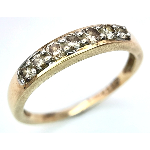 589 - A 9K YELLOW GOLD DIAMOND SET BAND RING. 0.25ctw, Size N, 1.8g total weight. Ref: SC 8007