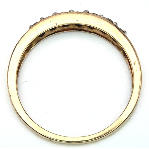 589 - A 9K YELLOW GOLD DIAMOND SET BAND RING. 0.25ctw, Size N, 1.8g total weight. Ref: SC 8007