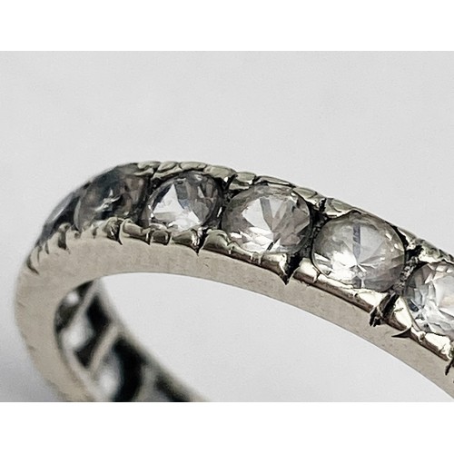 698 - A VINTAGE 9K WHITE GOLD (TESTED) DIAMOND FULL ETERNITY RING. 2.5G.  SIZE 0.