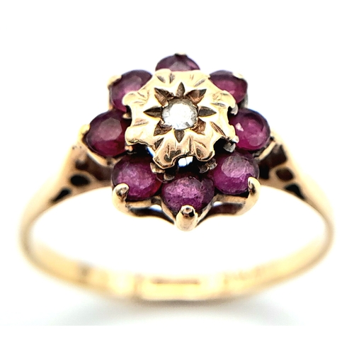 624 - A 9K YELLOW GOLD DIAMOND & RUBY CLUSTER RING. Size M, 1.7g total weight. Ref: SC 8015