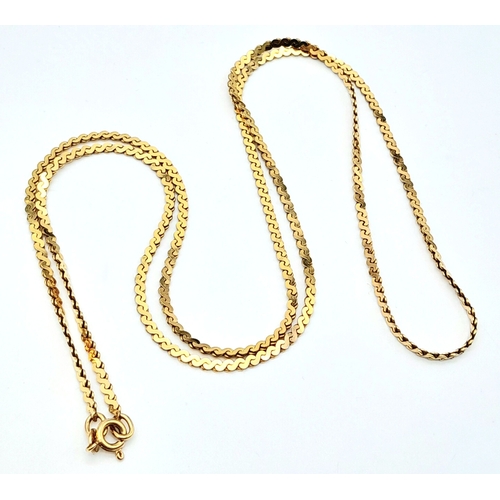 575 - A 9 K yellow gold flat chain necklace, length: 69 cm, weight: 11.9 g.