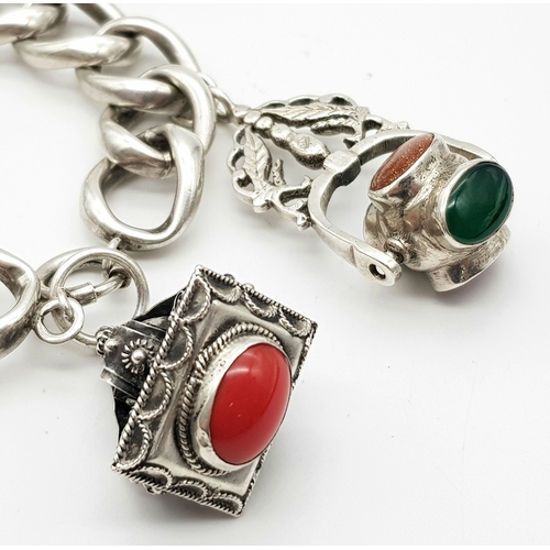 701 - AN UNUSUAL SILVER CHARM BRACELET WITH LARGE STONE SET CHARMS (SEE PHOTO)    90.6gms