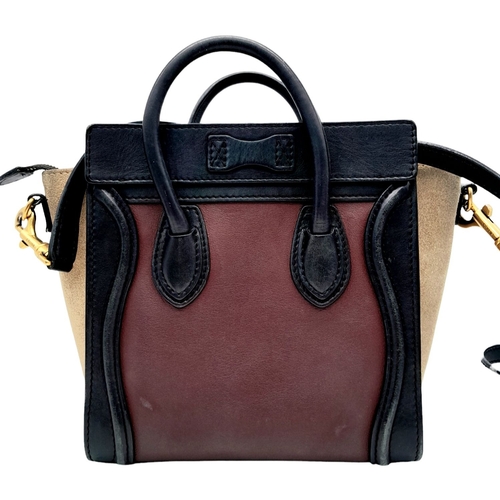 522 - A Celine Tri Colour Hand/Shoulder Bag. Burgundy and black leather exterior with soft textile sides. ... 