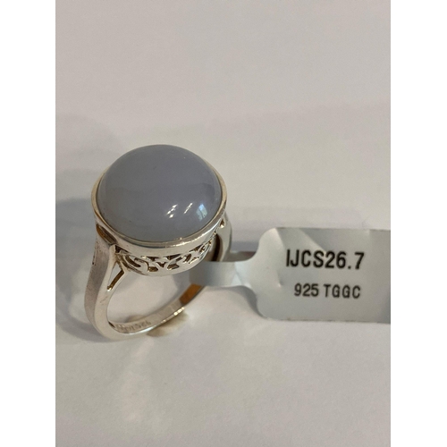 567 - SILVER and MOONSTONE CABACHON RING. Consisting a large circular Moonstone set in a Beautiful Pierced... 