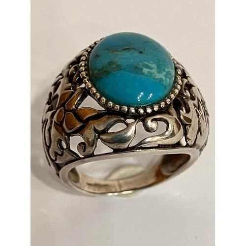 700 - Vintage SILVER and TURQUOISE RING. Consisting a large Oval polished TURQUOISE set into a wide SILVER... 