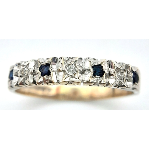 705 - A 9K WHITE GOLD DIAMOND AND SAPPHIRE RING. 2.1G. SIZE O