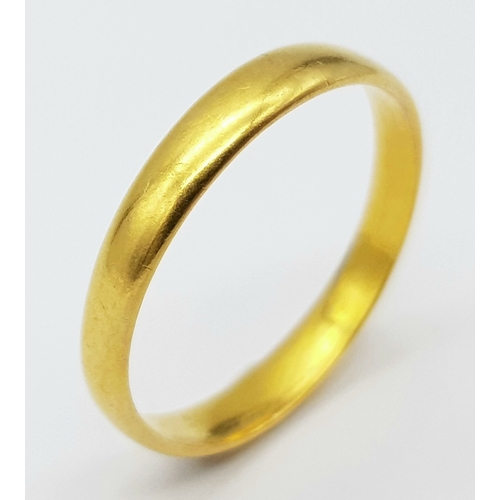 716 - A 22 K yellow gold convex band ring, size: O, weight: 2.4 g.