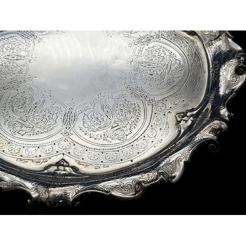 1848 - A 761gms solid silver Salva with scrolled edges and hand chased intricate decoration and hallmarked ... 