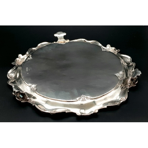 1848 - A 761gms solid silver Salva with scrolled edges and hand chased intricate decoration and hallmarked ... 