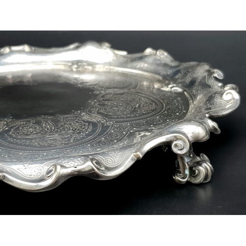 1848 - A 761gms solid silver Salva with scrolled edges and hand chased intricate decoration and hallmarked ... 