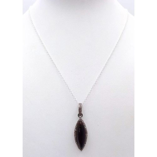 126 - A Marquise Cut Black Opal Pendant with Diamond Surround on 925 Silver and a Silver Chain. 3.75ct bla... 