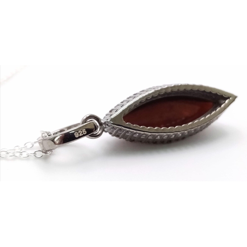 126 - A Marquise Cut Black Opal Pendant with Diamond Surround on 925 Silver and a Silver Chain. 3.75ct bla... 