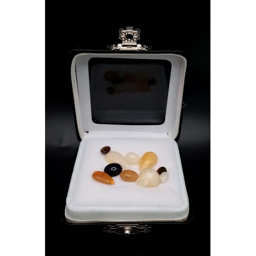 140 - An 11ctw Lot of Ethiopian Opals. 11 stones in a clip-open case.