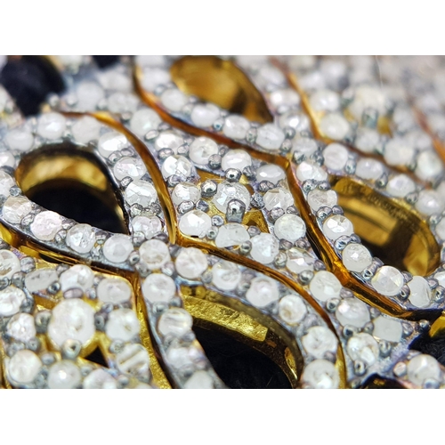 147 - A Brilliantly Unique Handcrafted Designer Diamond Bracelet. A black woven textile bracelet strap ado... 