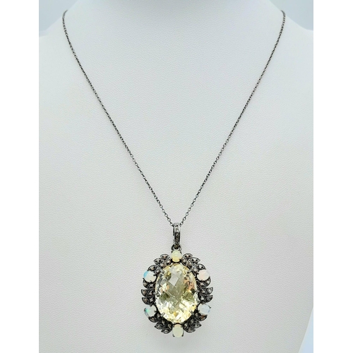 167 - A Citrine Pendant with Opal and Diamond Surround on 925 Silver Chain.22ct citrine, 1.30ctw opals, 0.... 