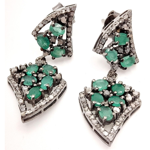 124 - A beautiful Late Victorian or Edwardian pair of silver earrings with numerous old cut diamonds and o... 