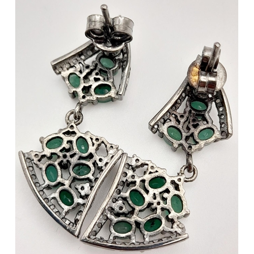 124 - A beautiful Late Victorian or Edwardian pair of silver earrings with numerous old cut diamonds and o... 