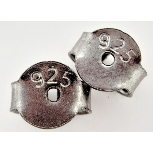 124 - A beautiful Late Victorian or Edwardian pair of silver earrings with numerous old cut diamonds and o... 