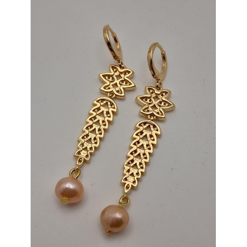 138 - A fabulous gold-plated pair of earrings with cubic zirconia and pink cultured pearls, presented in a... 